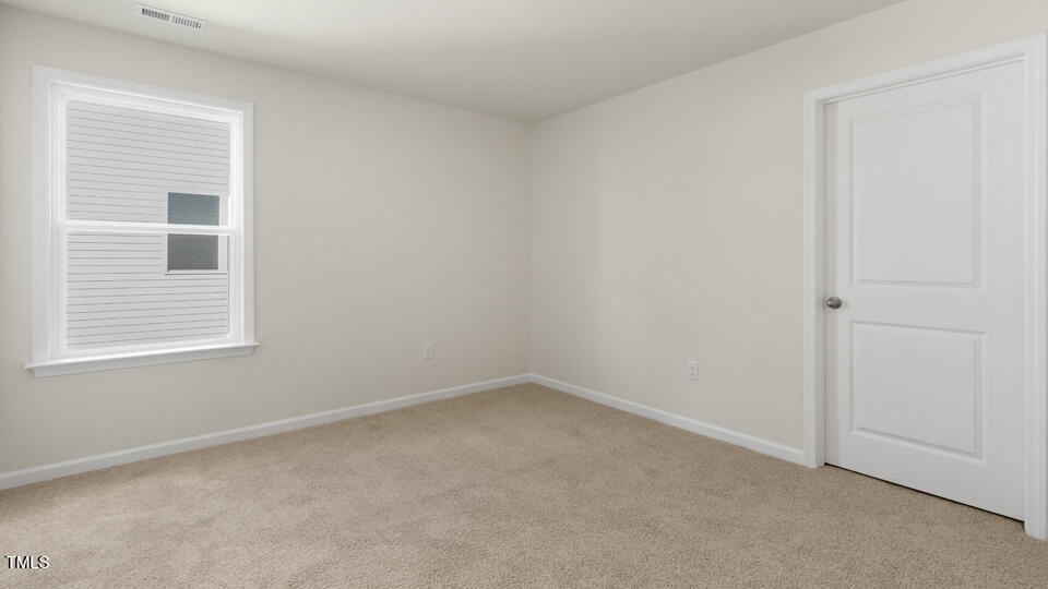 166 Red Jasper Way Clayton, NC 27520 - Photo 25 of 41 an empty room with a window