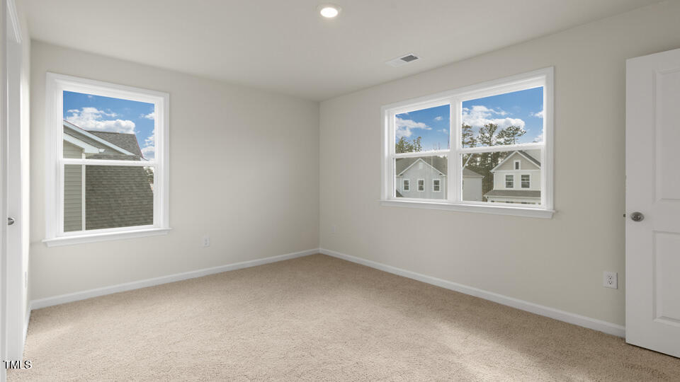 166 Red Jasper Way Clayton, NC 27520 - Photo 26 of 41 a view of an empty room with a window