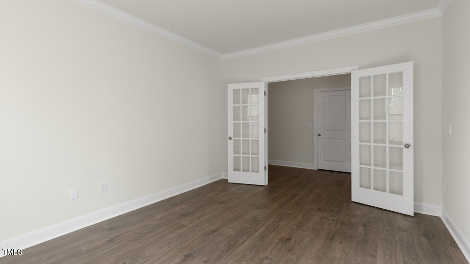 166 Red Jasper Way Clayton, NC 27520 - Photo 6 of 41 an empty room with wooden floor and windows