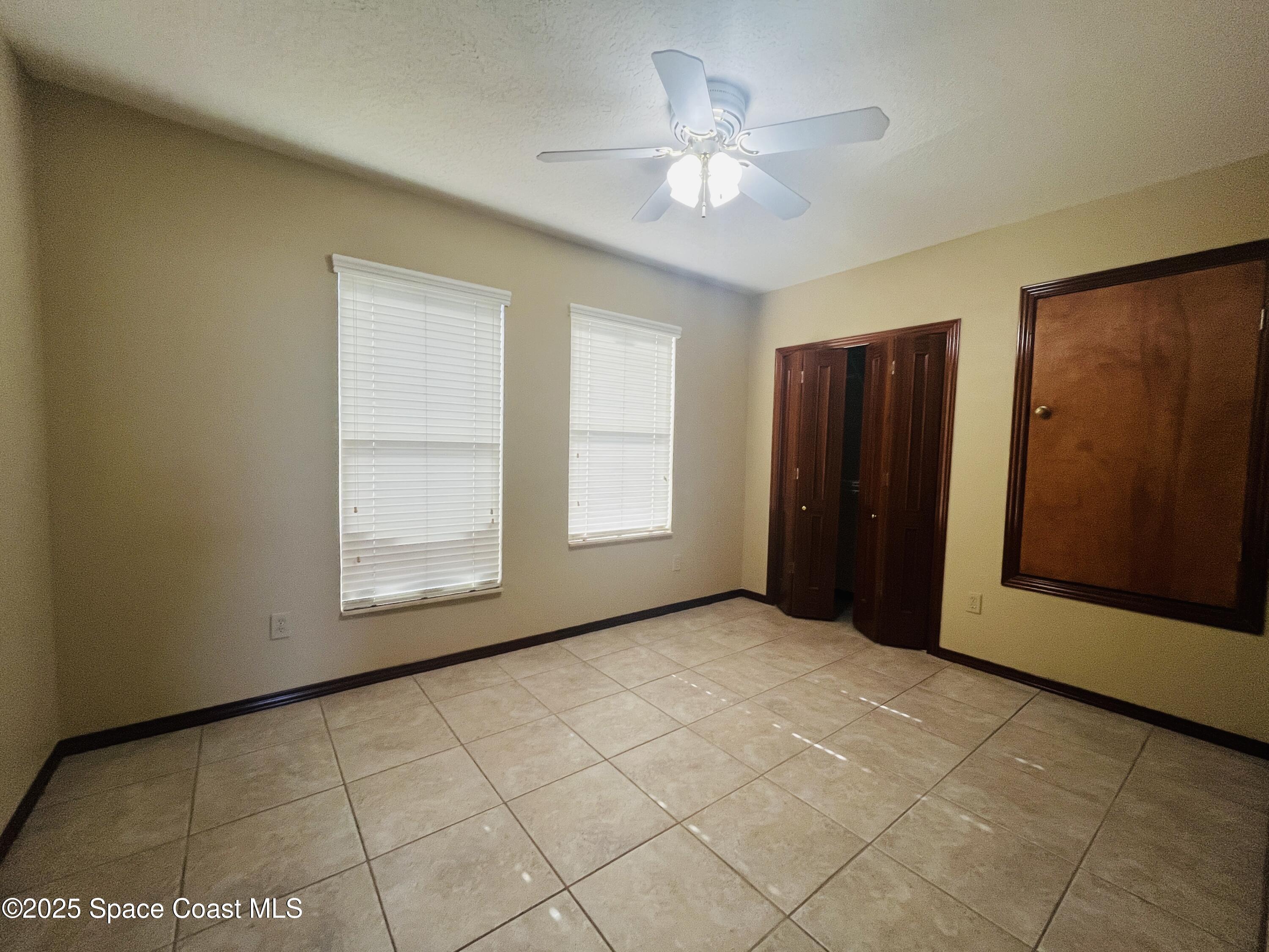 3 Florida Avenue, Unit B Cocoa, FL 32922 - Photo 7 of 10 an empty room with windows and closet