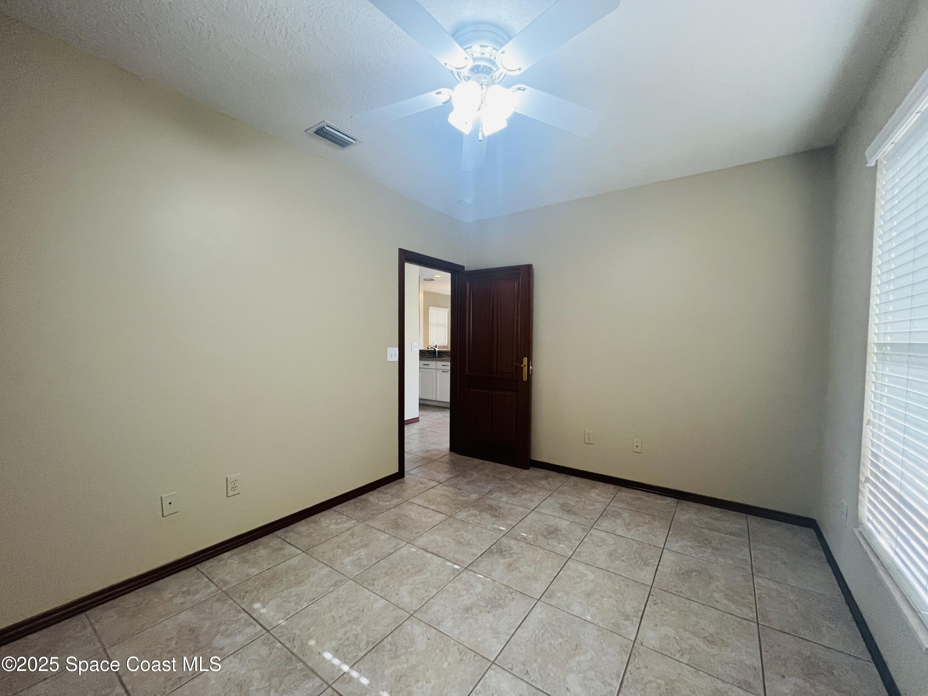 3 Florida Avenue, Unit B Cocoa, FL 32922 - Photo 8 of 10 a view of an empty room and a window