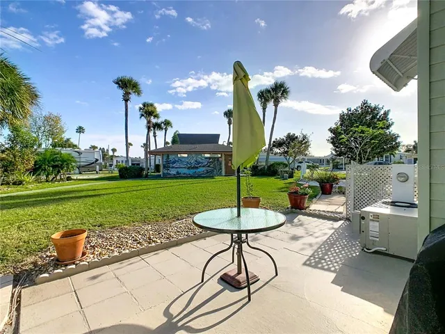 a view of a table and chairs in the garden