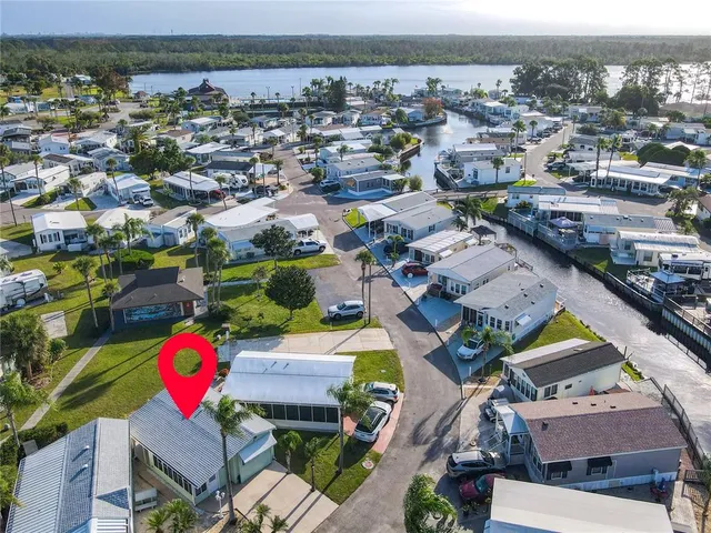 an aerial view of a houses with a swimming pool