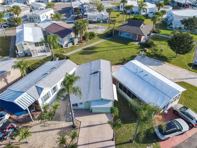 an aerial view of a houses with outdoor space