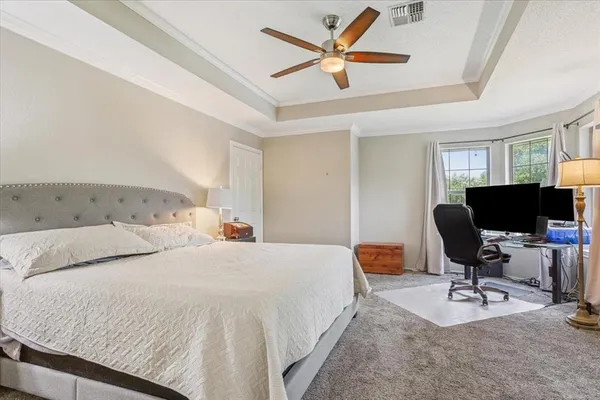 a bedroom with a workspace
