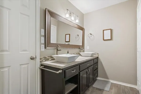 a bathroom with a sink and a mirror
