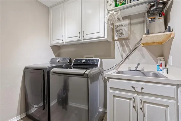 a view of storage and utility room with washer and dryer