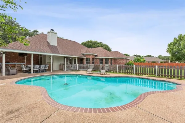 a view of a house with a swimming pool