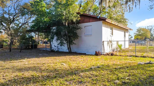 a view of a house with a yard and garage