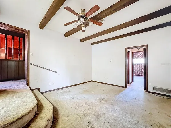a view of a room with wooden walls