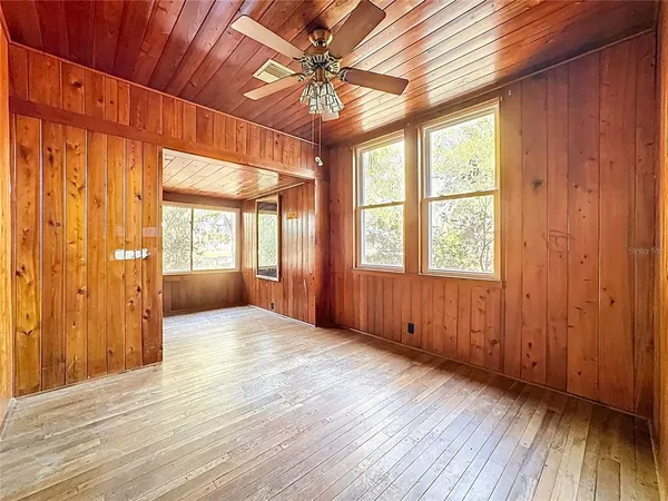 a view of an entryway with wooden floor and a window
