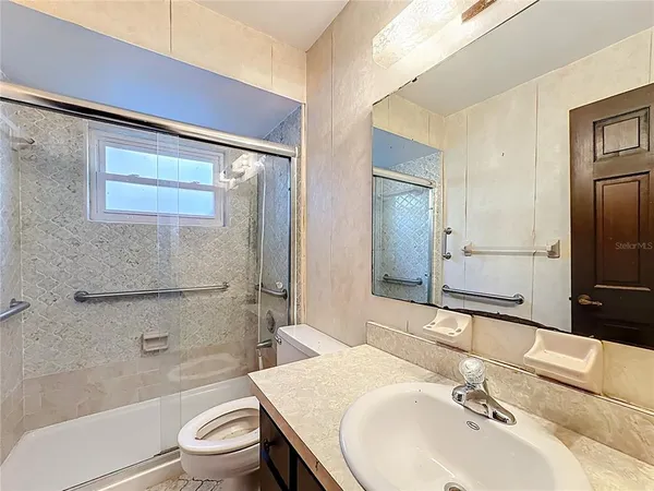 a view of an empty room with a window