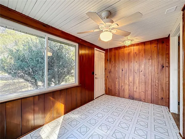a view of a room with wooden walls