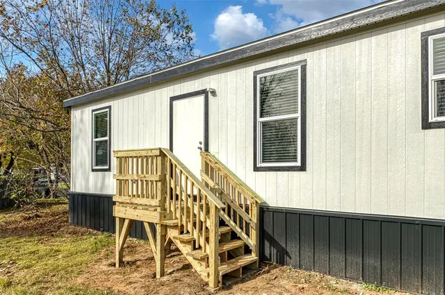 a view of a balcony with chairs