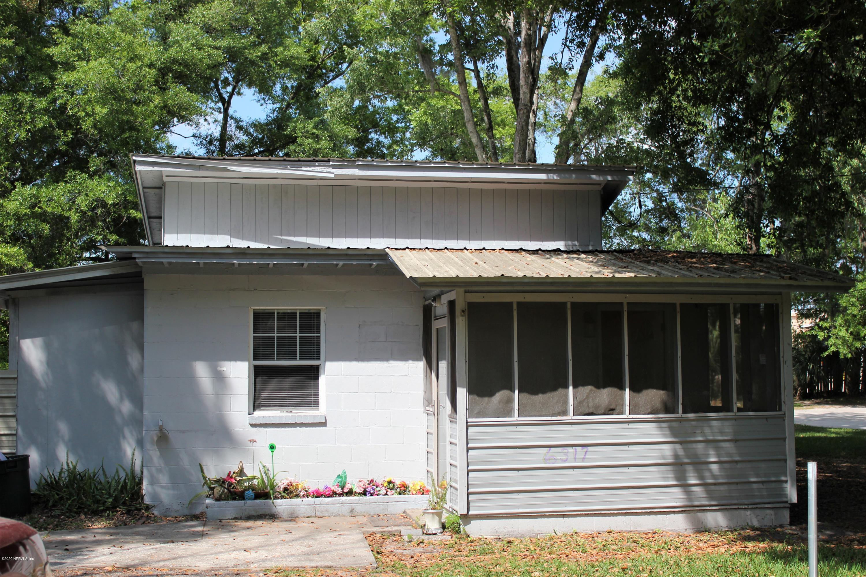 6317 Delacy Road Jacksonville, FL 32244 - Photo 1 of 12 front view of house with a small yard