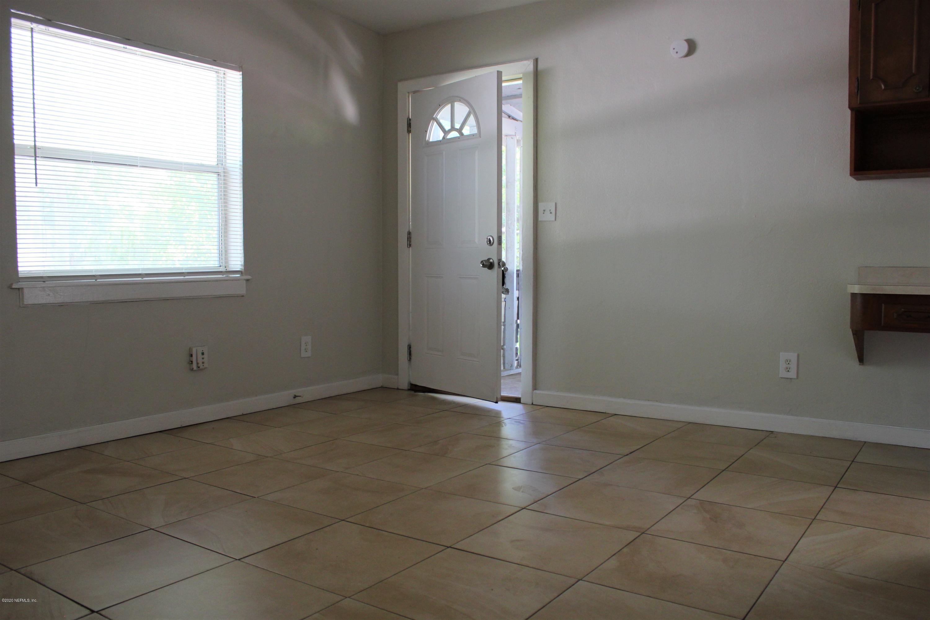 6317 Delacy Road Jacksonville, FL 32244 - Photo 4 of 12 a view of an empty room with a window