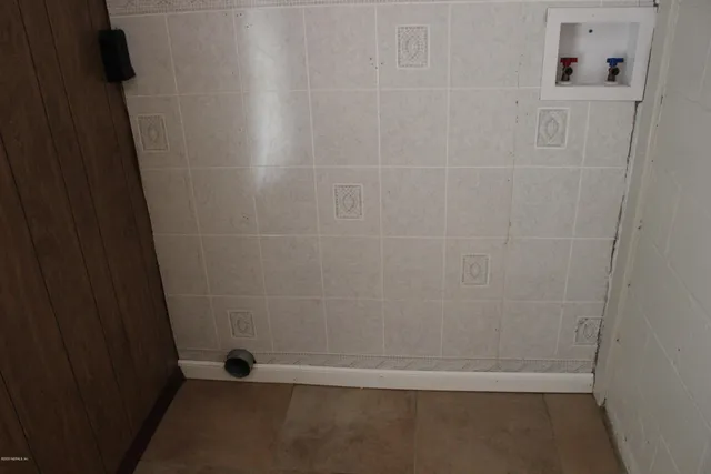 a utility room with washer and dryer