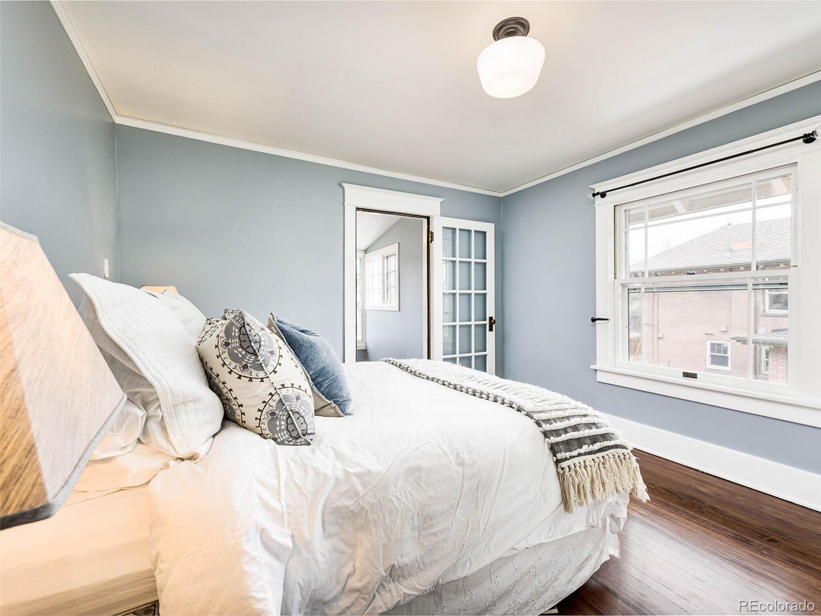 720 Franklin Street Denver, CO 80218 - Photo 20 of 38 a bedroom with a large bed and a window