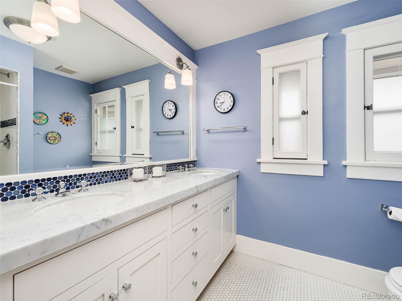720 Franklin Street Denver, CO 80218 - Photo 22 of 38 a bathroom with a sink and a mirror