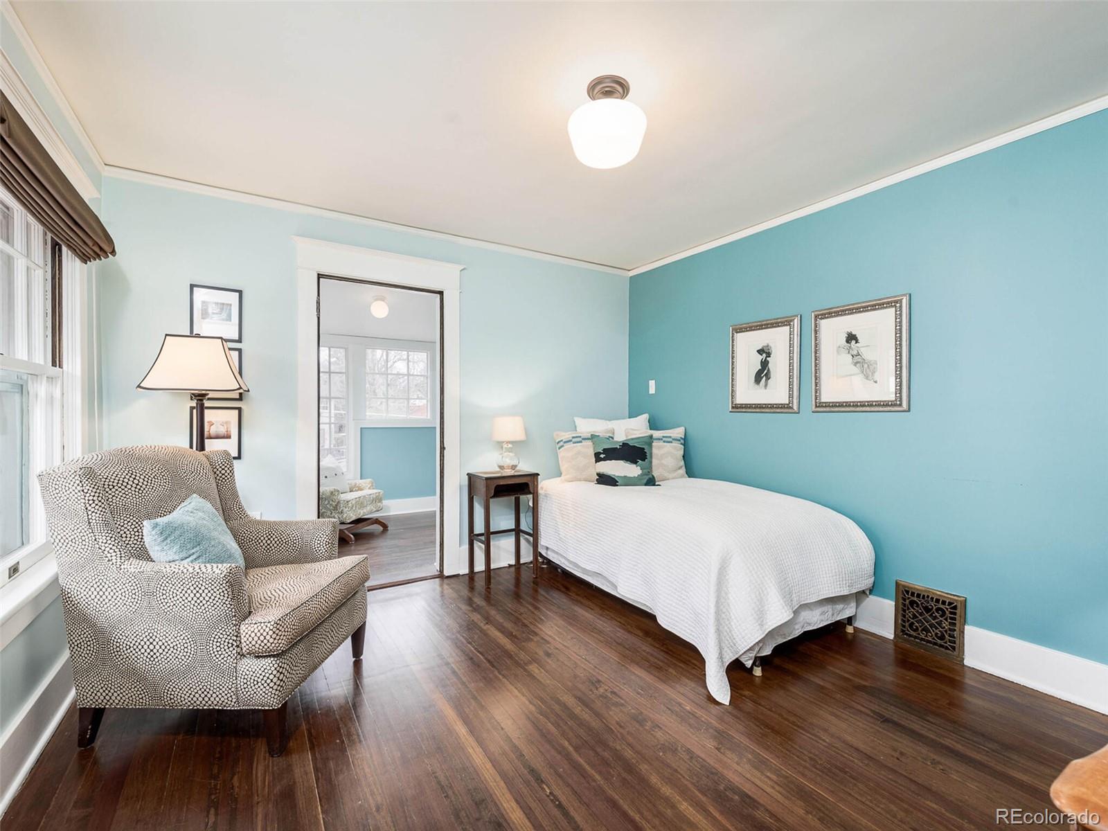 720 Franklin Street Denver, CO 80218 - Photo 23 of 38 a spacious bedroom with a bed a couch and dresser