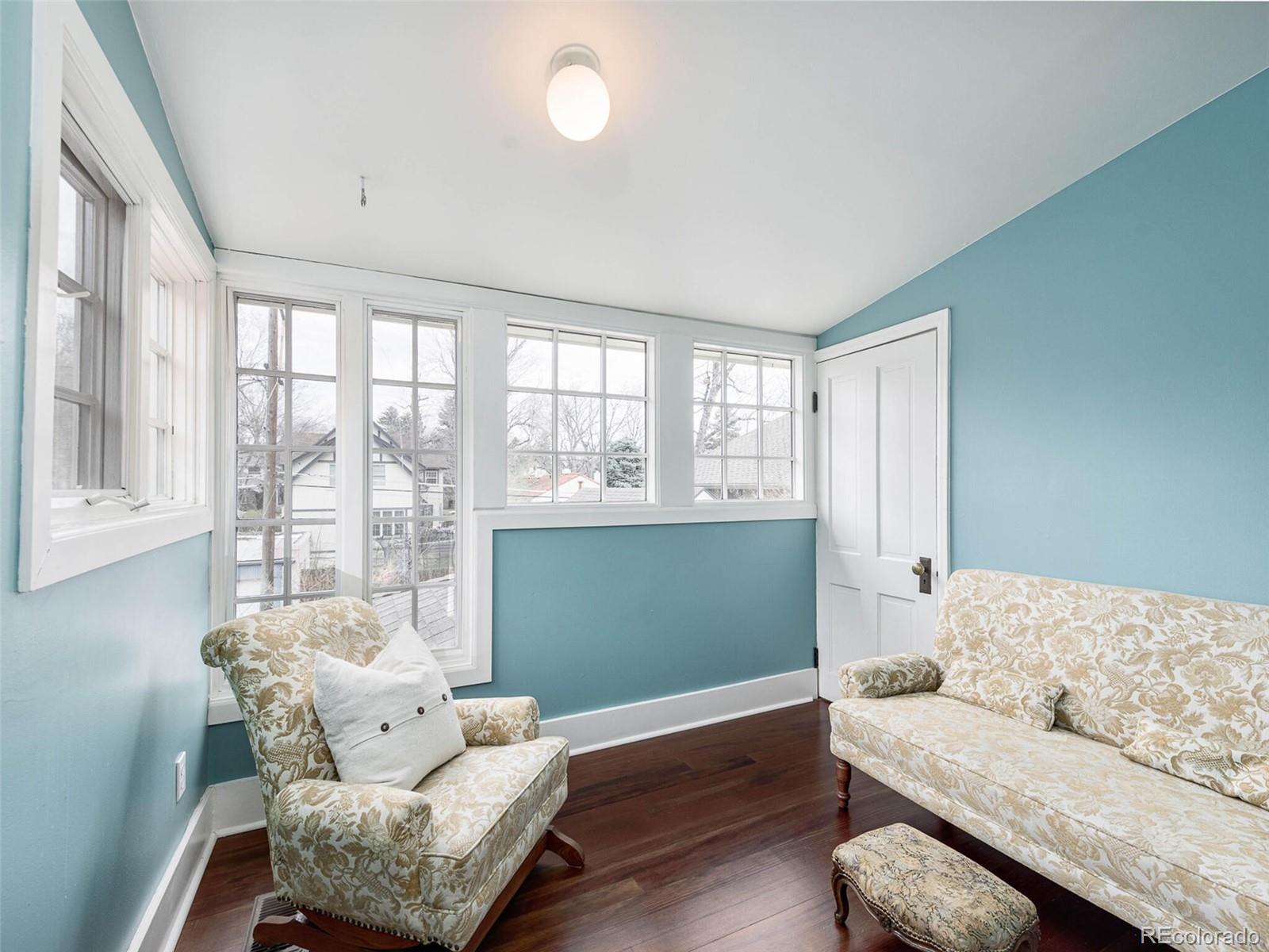 720 Franklin Street Denver, CO 80218 - Photo 24 of 38 a living room with furniture and a large window