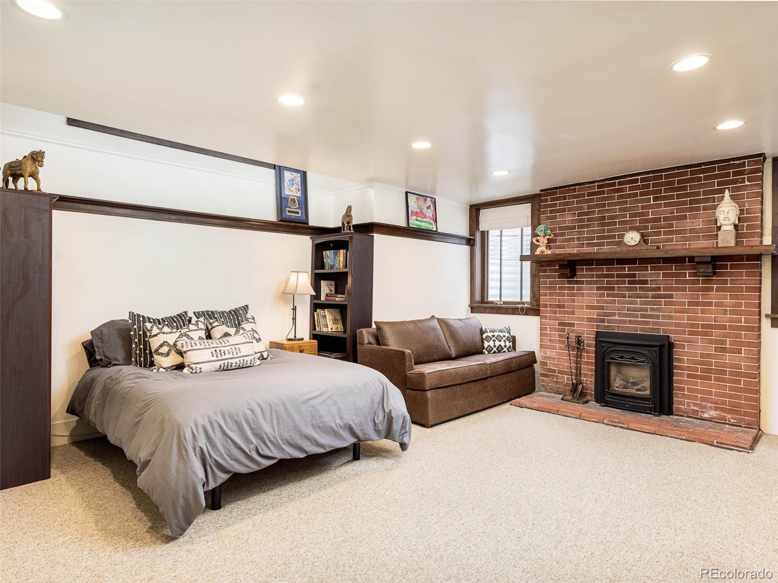 720 Franklin Street Denver, CO 80218 - Photo 28 of 38 a bedroom with a bed and a fireplace