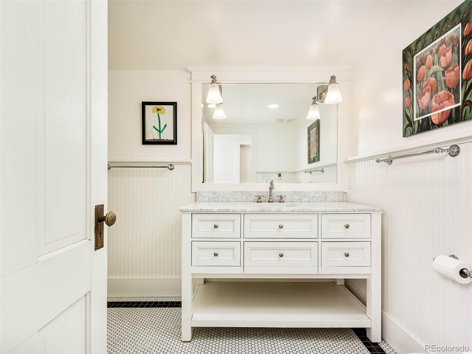 720 Franklin Street Denver, CO 80218 - Photo 29 of 38 a bathroom with a sink a mirror and a toilet
