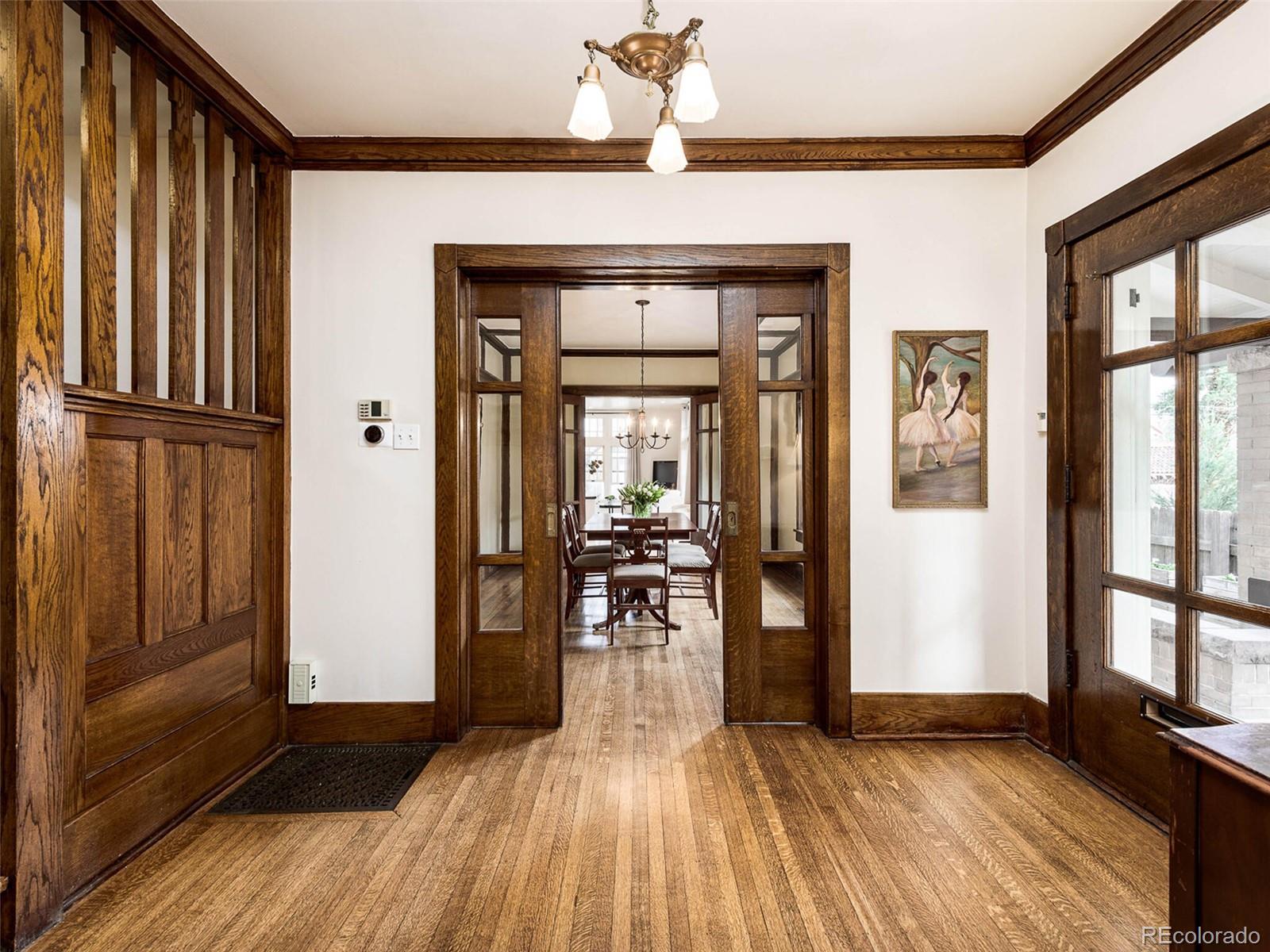 720 Franklin Street Denver, CO 80218 - Photo 6 of 38 a view of a livingroom with wooden floor and stairs