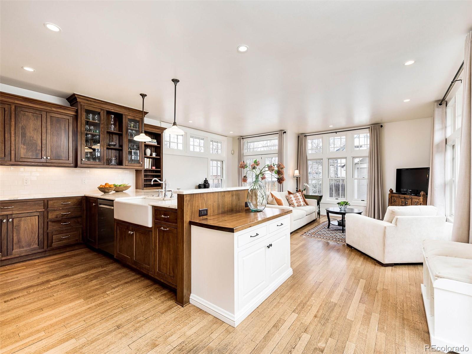 720 Franklin Street Denver, CO 80218 - Photo 8 of 38 a kitchen with stainless steel appliances granite countertop a stove and cabinets