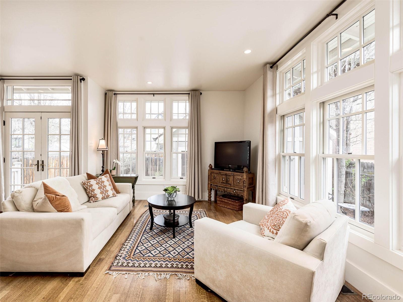 720 Franklin Street Denver, CO 80218 - Photo 10 of 38 a living room with furniture and a flat screen tv