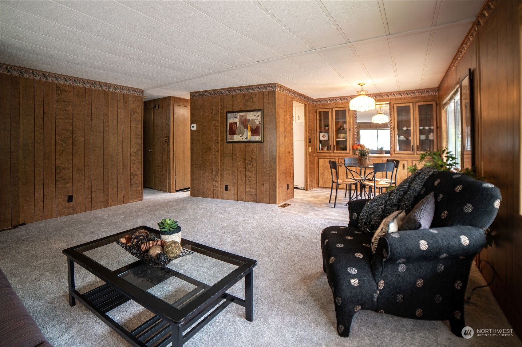 1121 244th Street Southwest, Unit 2 Bothell, WA 98021 - Photo 8 of 31 a living room with furniture and wooden floor