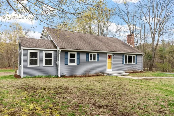a house that has a big yard in front of it