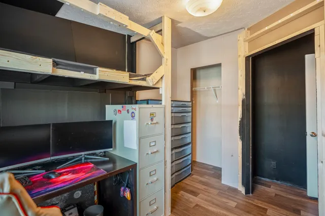 a room with furniture and a wooden floor