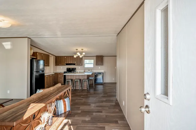a view of a kitchen from the hallway