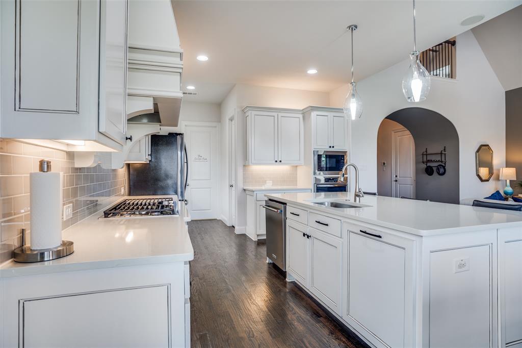 1011 Riviera Road Roanoke, TX 76262 - Photo 13 of 28 Light kitchen with large island and walk-in pantry access