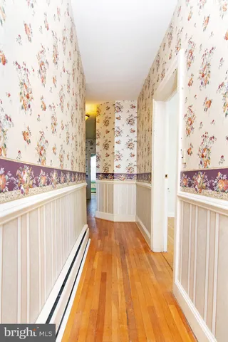 a picture of a wall with a white wall and a painting