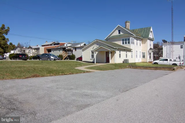 a view of entryway with wooden floor and stairs