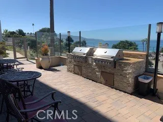 a terrace with a table and chairs