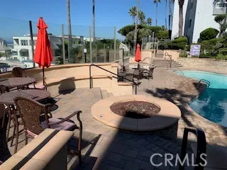 a view of a chairs and tables in patio