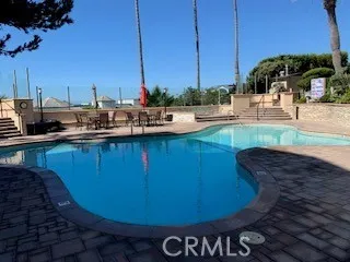 a view of a swimming pool with chairs