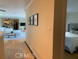 a view of living room with furniture and wooden floor