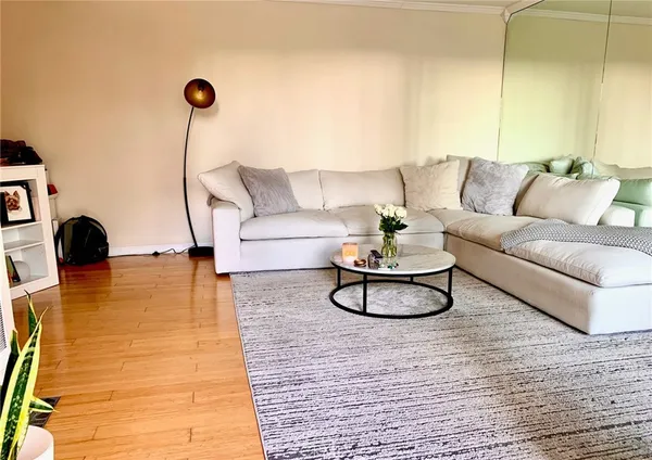 a living room with furniture and a rug