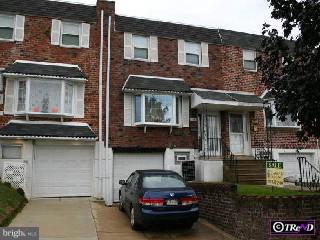 12405 Balston Road Philadelphia, PA 19154 - Photo 1 of 1 a car parked in front of a brick house