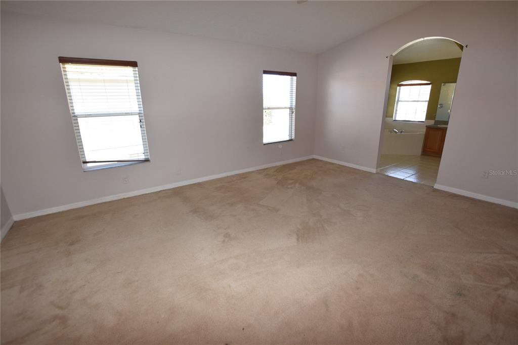 3118 Riachuelo Lane Kissimmee, FL 34744 - Photo 17 of 26 an empty room that has a window