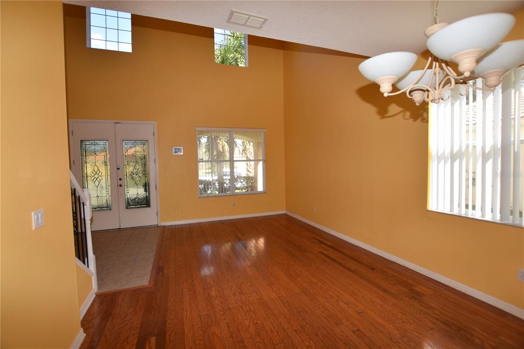 3118 Riachuelo Lane Kissimmee, FL 34744 - Photo 4 of 26 a view of empty room with wooden floor and fan