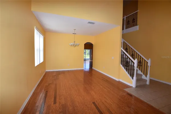 a view of an entryway with wooden floor
