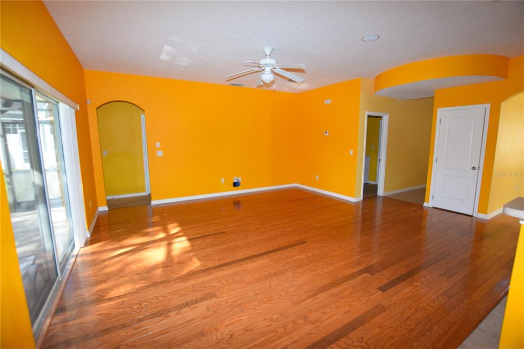3118 Riachuelo Lane Kissimmee, FL 34744 - Photo 10 of 26 a view of a room with wooden floor and a window