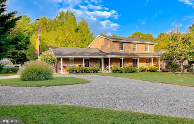 a kitchen with a sink appliances and cabinets