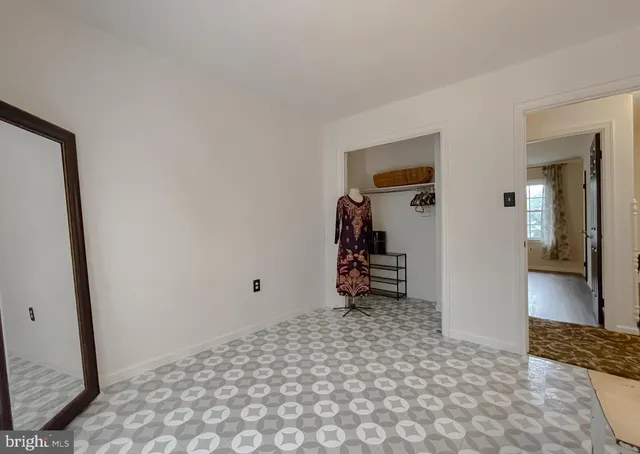 a bed room with a bed and a chandelier