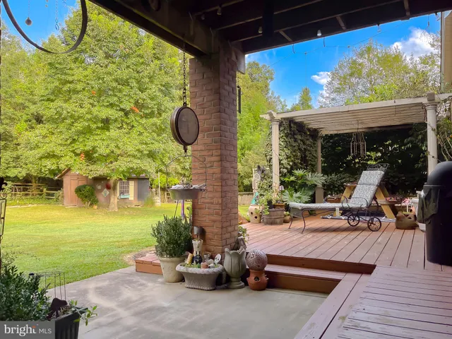 a front view of a house with a big yard